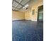 Garage featuring epoxy flooring, painted walls, and door to interior at 5075 Forest Downs Ln, Atlanta, GA 30349