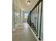 Hallway with light blue walls and dark railing at 5075 Forest Downs Ln, Atlanta, GA 30349