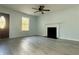 Bright living room featuring modern floors, fireplace, and bright windows at 5075 Forest Downs Ln, Atlanta, GA 30349