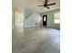 Inviting living room featuring modern floors, neutral paint, and bright windows at 5075 Forest Downs Ln, Atlanta, GA 30349