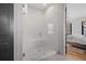 Stylish bathroom features a modern glass shower with white subway tile at 6845 Wesley Hughes Rd, Cumming, GA 30040