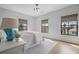 Bedroom featuring light walls, hardwood floors, neutral window coverings and beautiful natural light at 6845 Wesley Hughes Rd, Cumming, GA 30040