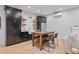Basement kitchenette with sleek cabinets, stainless steel appliances, wood shelving and island at 6845 Wesley Hughes Rd, Cumming, GA 30040