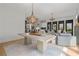 A bright open concept living room and dining room features hardwood floors at 6845 Wesley Hughes Rd, Cumming, GA 30040