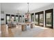 Open floor plan with hardwood floors and lots of natural light coming in from many windows at 6845 Wesley Hughes Rd, Cumming, GA 30040