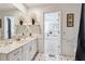 Bright bathroom features tile flooring, and a combined laundry room at 9991 Holly Hill Way, Jonesboro, GA 30238