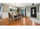 Traditional dining room showcasing wood floors, wainscoting, and a large window at 9991 Holly Hill Way, Jonesboro, GA 30238