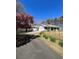 Scenic property with a charming house, garage, split rail fence, and lush landscaping at 9991 Holly Hill Way, Jonesboro, GA 30238
