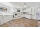 Bright laundry room with white cabinets, a washer/dryer, and a sink at 9991 Holly Hill Way, Jonesboro, GA 30238