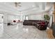 Spacious living room featuring tile floors, coffered ceilings, fireplace and large windows at 9991 Holly Hill Way, Jonesboro, GA 30238