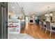 Inviting open-concept space seamlessly connecting the dining area, kitchen, and living room with a fireplace at 9991 Holly Hill Way, Jonesboro, GA 30238