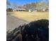 Sprawling property with a well-manicured lawn and a long driveway leading to the home and garages at 9991 Holly Hill Way, Jonesboro, GA 30238