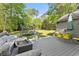 Enjoy a large, grassy backyard with ample space for outdoor activities and relaxation on the patio at 10070 Timberstone Rd, Johns Creek, GA 30022
