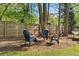Cozy backyard seating area around a firepit, perfect for relaxing evenings at 10070 Timberstone Rd, Johns Creek, GA 30022