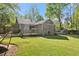 Backyard view with a lush lawn, garden, and cozy hammock at 10070 Timberstone Rd, Johns Creek, GA 30022