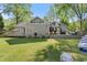 Spacious backyard with well-manicured lawn and large deck, perfect for outdoor entertaining at 10070 Timberstone Rd, Johns Creek, GA 30022