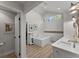 Bright bathroom boasts double sinks, skylights, and a soaking tub with tile surround at 10070 Timberstone Rd, Johns Creek, GA 30022