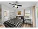 Comfortable bedroom featuring a bed, stylish furnishings, and a sunny window at 10070 Timberstone Rd, Johns Creek, GA 30022