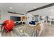 Open-concept living room with a large TV, modern furniture, stylish decor, and an open view to the kitchen at 10070 Timberstone Rd, Johns Creek, GA 30022