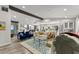 Spacious and stylish living room with an open layout, flowing into the dining and kitchen areas at 10070 Timberstone Rd, Johns Creek, GA 30022