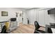 Cozy office space featuring wood-look flooring, a computer, and a modern chair at 10070 Timberstone Rd, Johns Creek, GA 30022