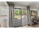 Living area slider provides access to a covered patio and manicured yard at 10070 Timberstone Rd, Johns Creek, GA 30022