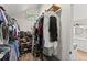 Walk-in closet with ample storage and shoe rack at 10070 Timberstone Rd, Johns Creek, GA 30022