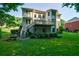 Multi-level home boasts a spacious deck and well-maintained backyard for outdoor living at 1192 Lake Washington Dr, Lawrenceville, GA 30043