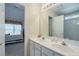 Bright bathroom features a double vanity, and a view into the bedroom at 1192 Lake Washington Dr, Lawrenceville, GA 30043