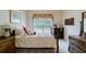 Comfortable bedroom with charming decor, including a quilt, dresser, and vintage accents at 1192 Lake Washington Dr, Lawrenceville, GA 30043