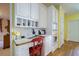 Kitchen desk area with built-in storage, white countertops, and a small work space at 1192 Lake Washington Dr, Lawrenceville, GA 30043