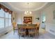 Elegant dining room with tray ceilings, a chandelier, and a large window at 1192 Lake Washington Dr, Lawrenceville, GA 30043