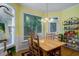 Sunny dining room with a large window and a view of the outdoor greenery at 1192 Lake Washington Dr, Lawrenceville, GA 30043