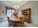 Traditional dining room with wood furniture, decorative accents, and natural light at 1192 Lake Washington Dr, Lawrenceville, GA 30043