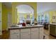 Open kitchen area featuring a cooktop island and seamless flow into the living room at 1192 Lake Washington Dr, Lawrenceville, GA 30043