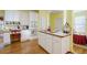 Bright kitchen showcasing white cabinets, hardwood floors and built-in appliances at 1192 Lake Washington Dr, Lawrenceville, GA 30043