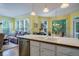 Spacious kitchen area featuring stainless steel appliances and a seamless flow into the dining area at 1192 Lake Washington Dr, Lawrenceville, GA 30043