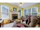 Inviting living room features a stone fireplace, plush seating, and large windows at 1192 Lake Washington Dr, Lawrenceville, GA 30043
