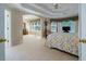 Spacious main bedroom boasting tray ceilings, neutral carpeting, and a sitting area bathed in natural light at 1192 Lake Washington Dr, Lawrenceville, GA 30043