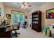 Functional home office space with a large window, desk, and ample storage at 1192 Lake Washington Dr, Lawrenceville, GA 30043
