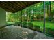 Covered patio area for relaxing outdoors, with views of the lush backyard at 1192 Lake Washington Dr, Lawrenceville, GA 30043