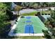 A vibrant community basketball court ready for play, featuring blue and green surfaces at 7045 Threadstone Overlook, Johns Creek, GA 30097