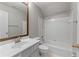This bathroom features a single sink vanity and a tiled shower and tub combination at 7045 Threadstone Overlook, Johns Creek, GA 30097