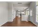 Open floorplan showcasing the kitchen, dining area, and view to front of home at 7045 Threadstone Overlook, Johns Creek, GA 30097