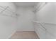 Walk-in closet with carpeted floor and wire shelving for ample storage at 7045 Threadstone Overlook, Johns Creek, GA 30097