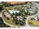 An aerial view of community amenities: pool, tennis courts, garden, playground, and walking trails at 81 Richmond Way, Villa Rica, GA 30180