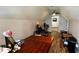 This attic is used for work and storage and features hardwood floors and pitched roof at 81 Richmond Way, Villa Rica, GA 30180