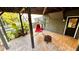 Covered back patio featuring a swing chair and outdoor entertainment space at 81 Richmond Way, Villa Rica, GA 30180