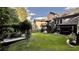 Expansive backyard featuring a covered patio, deck, and lush green lawn at 81 Richmond Way, Villa Rica, GA 30180