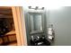Modern bathroom with stylish lighting fixtures, sleek sink, and view into Primary bedroom at 81 Richmond Way, Villa Rica, GA 30180
